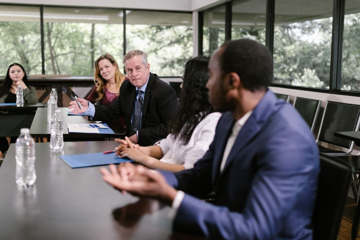 Policymakers and agency leaders in a meeting